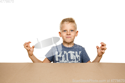 Image of Cute little boy opening the biggest postal package