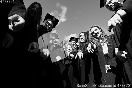 Image of Group of diverse international graduating students celebrating