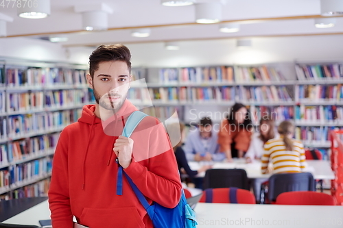 Image of the student uses a laptop and a school library