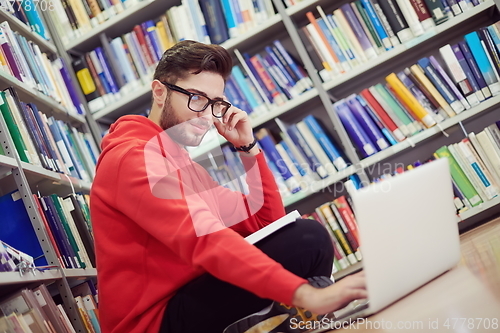 Image of the students uses a notebook, laptop and a school library