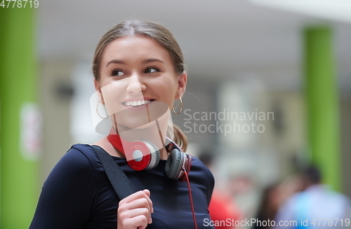 Image of famel student with modern technology in school