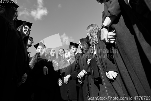 Image of Group of diverse international graduating students celebrating