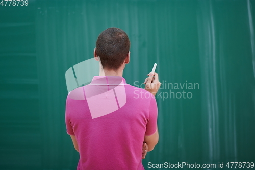 Image of the student does the task on the board