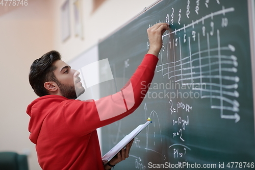 Image of the student does the task on the board