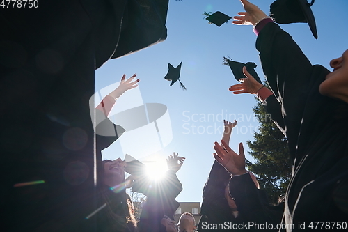 Image of Group of diverse international graduating students celebrating