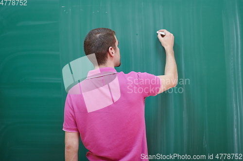 Image of the student does the task on the board