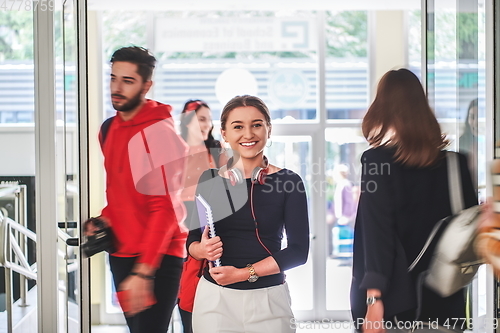 Image of famel student with modern technology in school