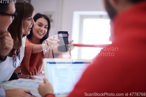 Image of students group working on school project together on tablet computer at modern university