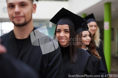 Image of Group of diverse international graduating students celebrating