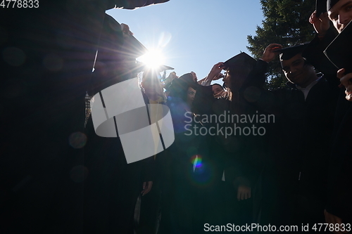 Image of Group of diverse international graduating students celebrating