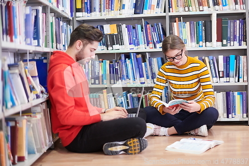 Image of the students uses a notebook, laptop and a school library