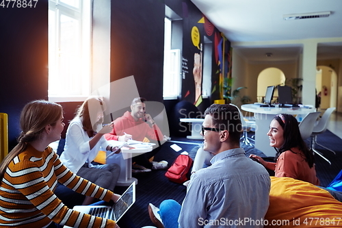 Image of students using modern technology for school project