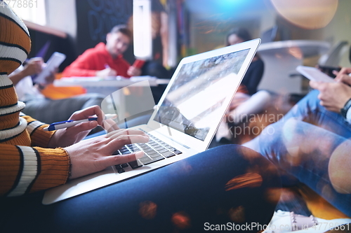 Image of students using modern technology for school project