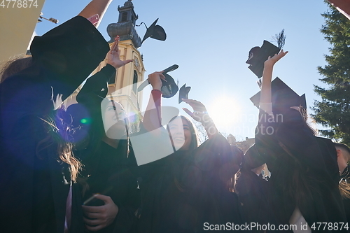 Image of Group of diverse international graduating students celebrating