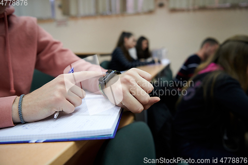 Image of the student uses a smartwatch in math class