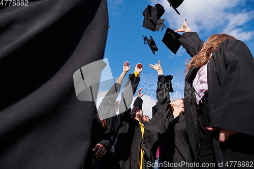 Image of Group of diverse international graduating students celebrating