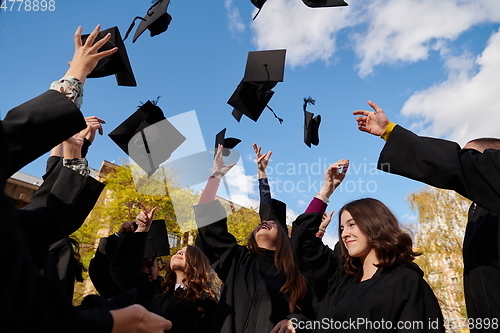 Image of Group of diverse international graduating students celebrating