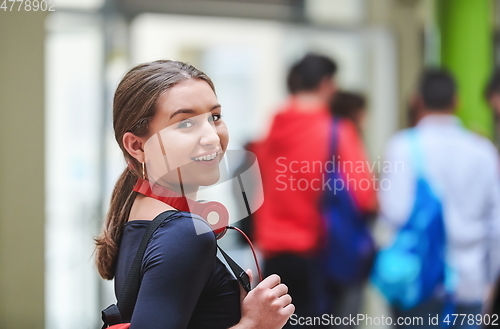 Image of famel student with modern technology in school