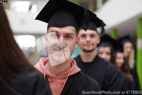 Image of Group of diverse international graduating students celebrating