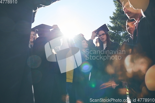 Image of Group of diverse international graduating students celebrating