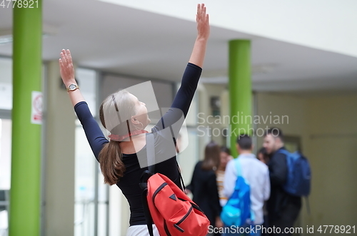 Image of famel student with modern technology in school