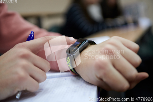 Image of the student uses a smartwatch in math class
