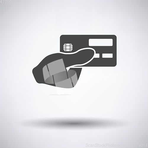 Image of Hand holding credit card icon