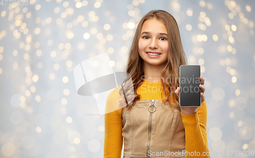 Image of smiling teenage girl showing smartphone