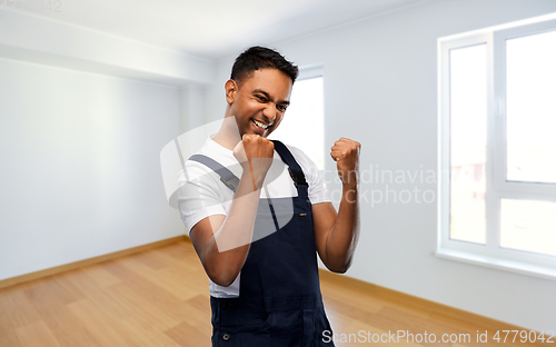 Image of indian builder celebrating success at new home