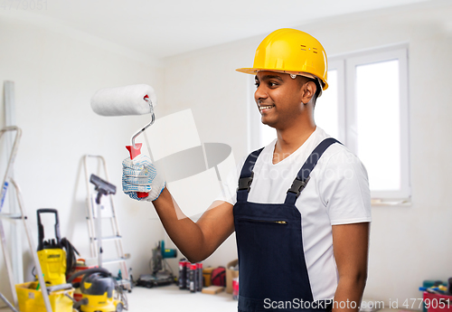 Image of happy indian painter or builder with paint roller