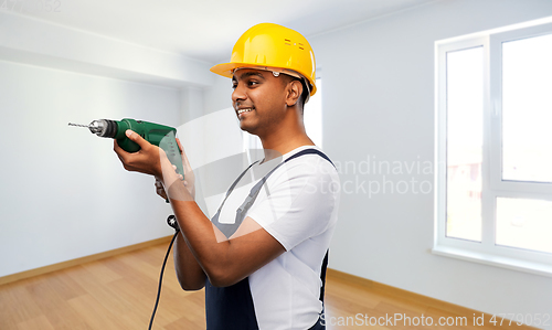 Image of happy indian builder in helmet with electric drill