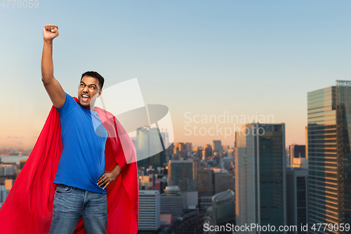 Image of indian superhero makes winning gesture in city