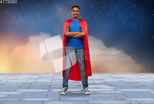 Image of happy smiling indian man in red superhero cape