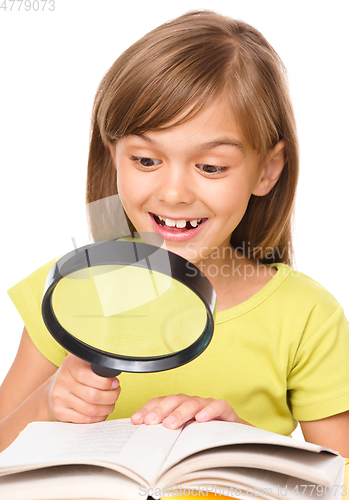 Image of Little girl is reading book