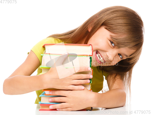 Image of Little girl with her books