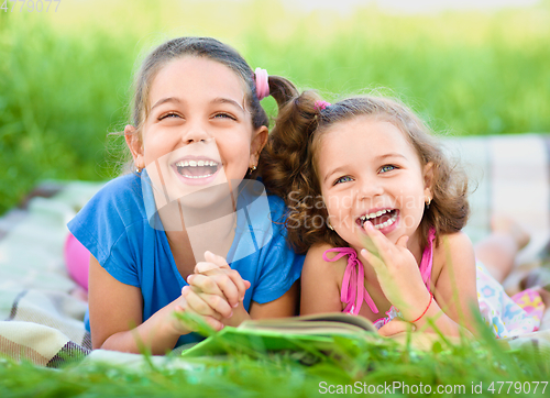 Image of Two little girls are reading book