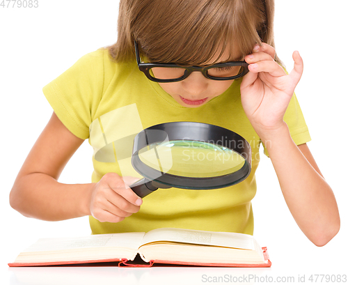 Image of Little girl is reading book
