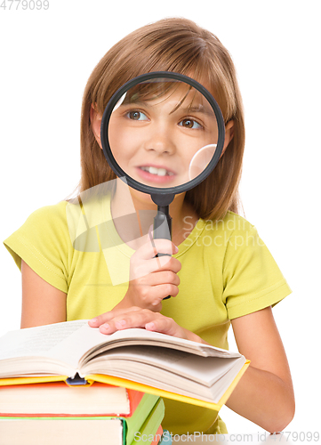 Image of Little girl is reading book