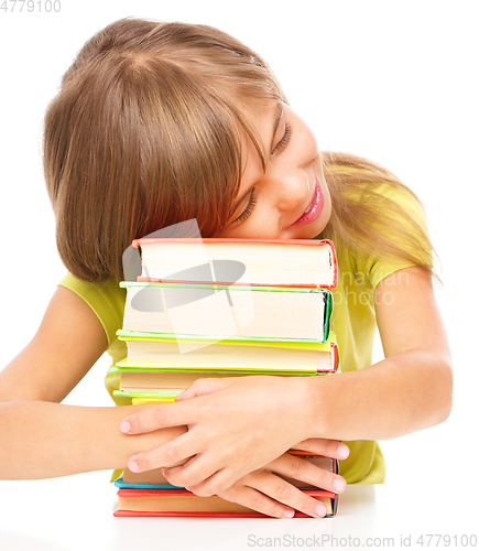 Image of Little girl with her books