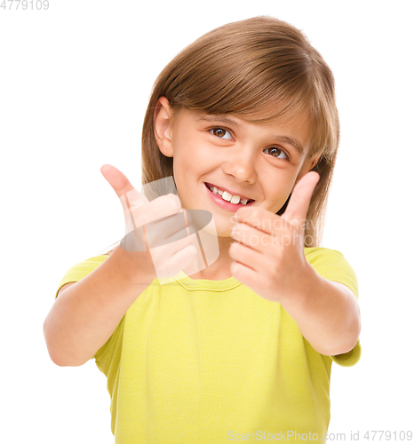 Image of Little girl is showing thumb up sign