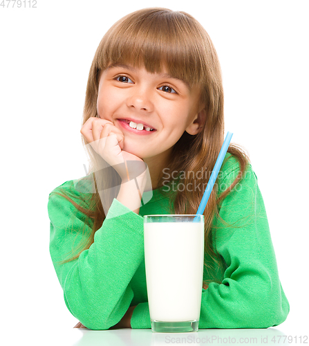 Image of Cute little girl with a glass of milk
