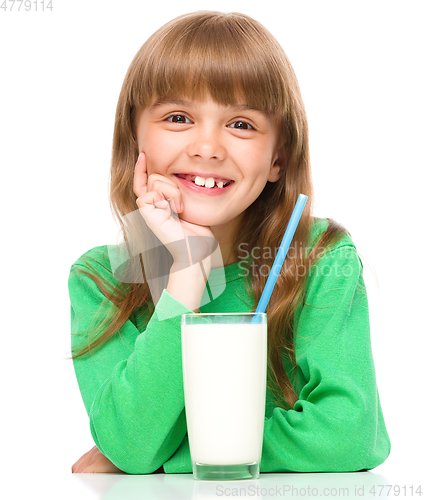 Image of Cute little girl with a glass of milk