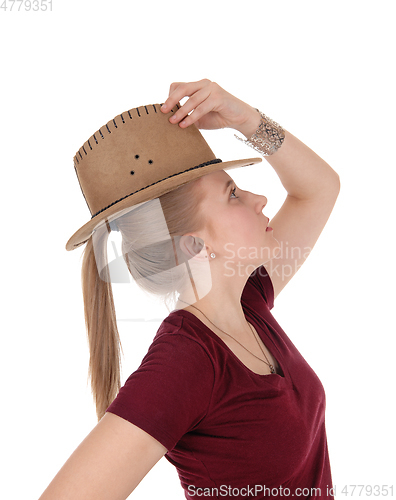 Image of Woman posing with brown cowboy hat