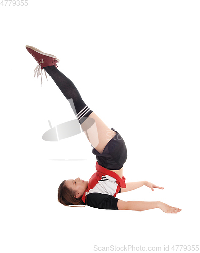 Image of Young woman with gymnastics on floor