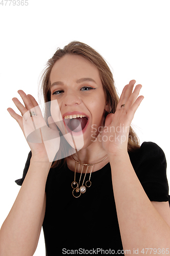 Image of Young lovely woman screaming 
