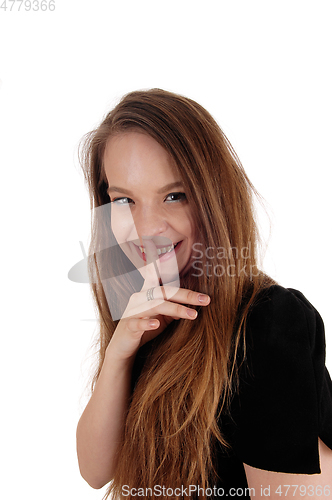 Image of Woman holding finger over her mouth