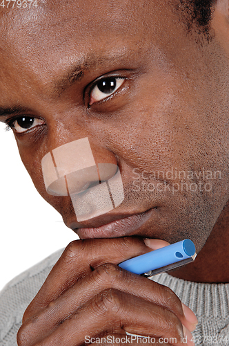 Image of Close up portrait of African man looking thoughtful