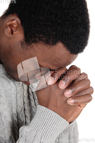 Image of Praying African man with his hands folded