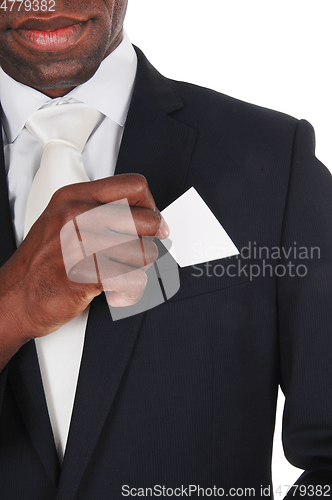 Image of Black man putting business card in pocket