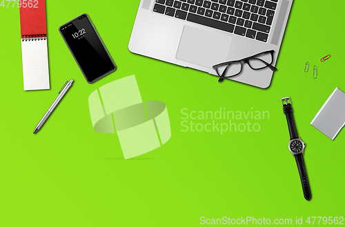 Image of Office desk mockup top view isolated on green